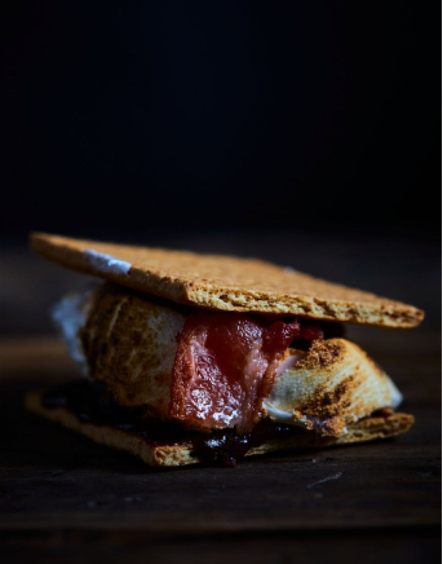 graham crackers with roasted marshmallow, chocolate, and bacon in between