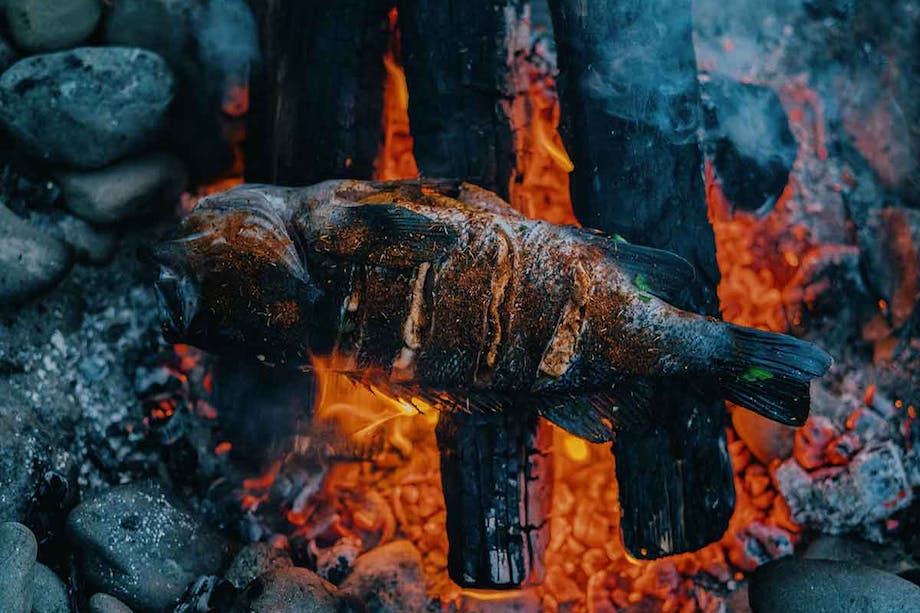 rockfish roasting over red hot coals