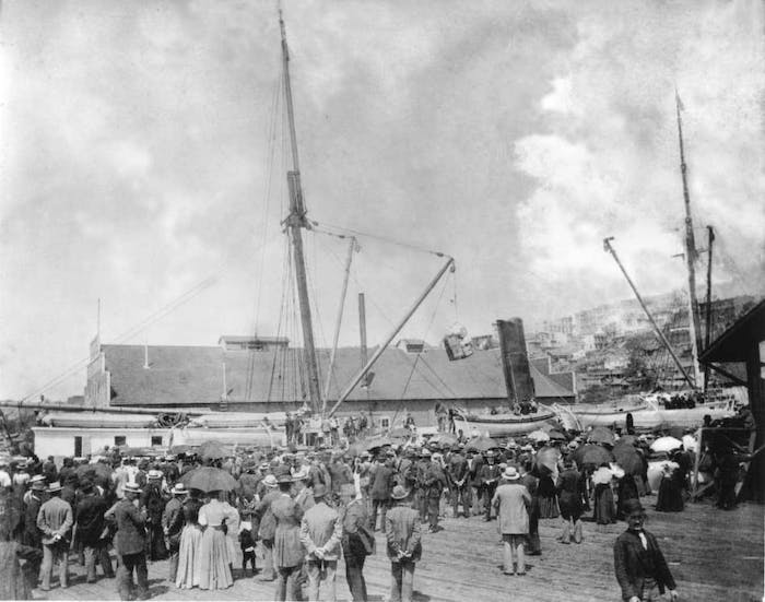 Black and white image of a crowd looking at the SS Portland at Schwabachers Wharf